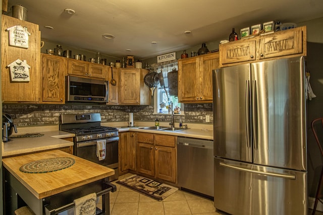 20 Hemlock Subdivision Rd, Williamsburg, KY 40769 - kitchen featuring appliances with stainless steel finishes, a sink, light countertops, and decorative backsplash