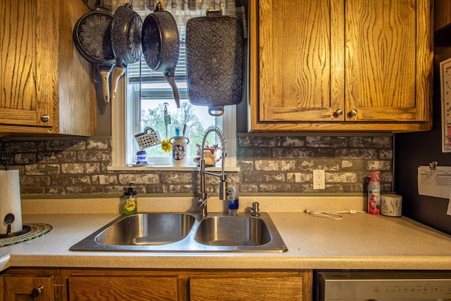20 Hemlock Subdivision Rd, Williamsburg, KY 40769 - kitchen with a sink, dishwashing machine, brown cabinetry, and light countertops
