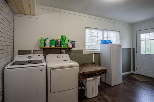 20 Hemlock Subdivision Rd, Williamsburg, KY 40769 - laundry room featuring washing machine and clothes dryer, wood finished floors, and brick wall