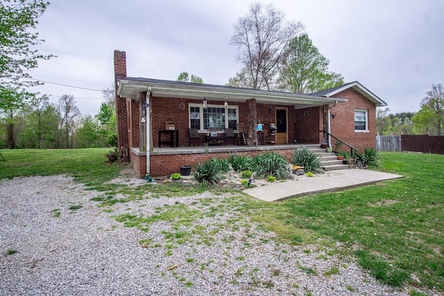 20 Hemlock Subdivision Rd, Williamsburg, KY 40769 - view of front of property with a chimney, brick siding, and covered porch