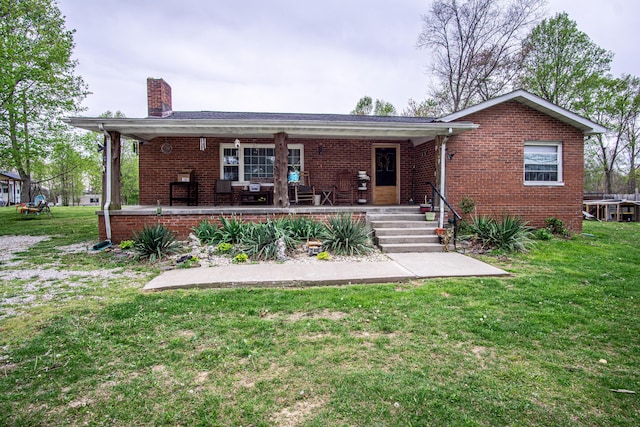 20 Hemlock Subdivision Rd, Williamsburg, KY 40769 - rear view of property featuring a chimney, brick siding, and a yard