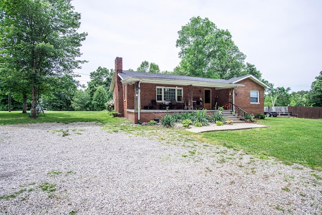20 Hemlock Subdivision Rd, Williamsburg, KY 40769 - single story home with a chimney, brick siding, and covered porch