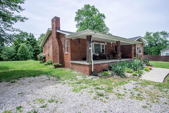 20 Hemlock Subdivision Rd, Williamsburg, KY 40769 - view of front of home featuring a chimney, covered porch, and brick siding