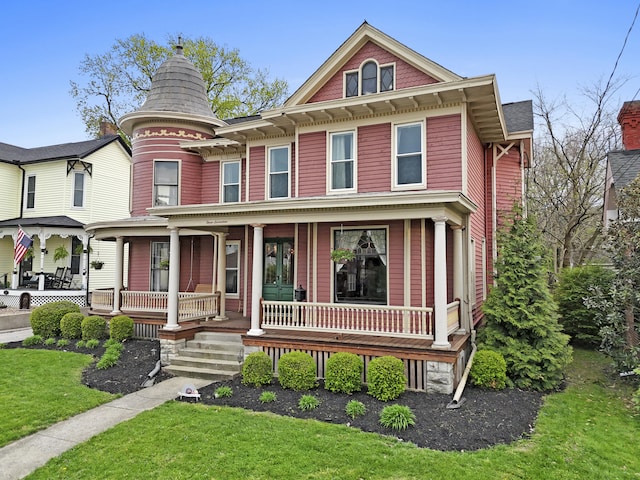 victorian-style house with covered porch and a front yard