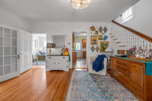 entryway with stairway and light wood-style floors
