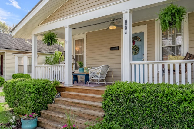 doorway to property with roof with shingles and covered porch