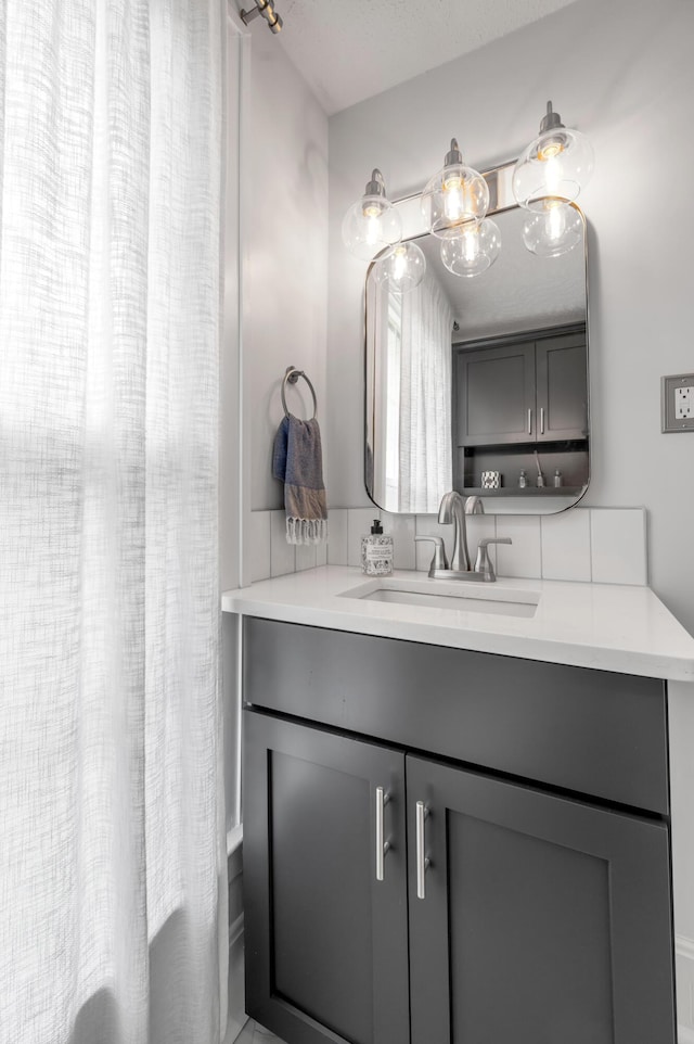 full bathroom featuring shower / bath combo with shower curtain and vanity