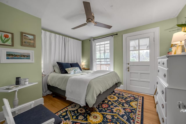bedroom featuring light wood-style flooring and ceiling fan