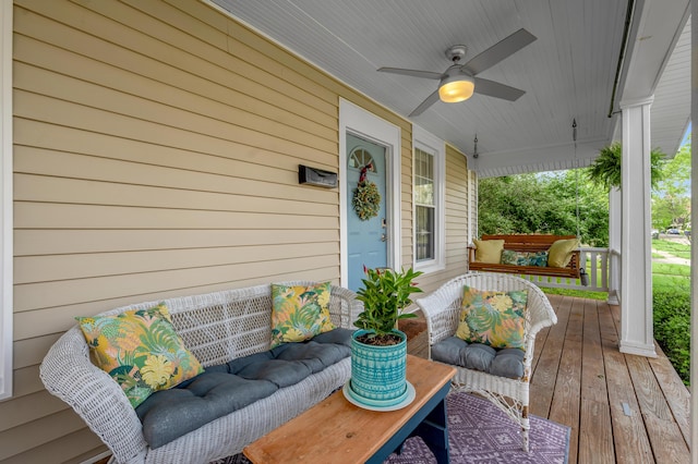 deck featuring a ceiling fan and a porch