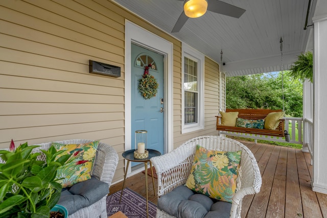 property entrance featuring a porch and ceiling fan