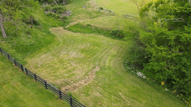 birds eye view of property with a rural view