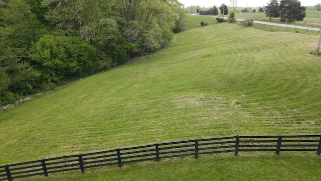 birds eye view of property with a rural view