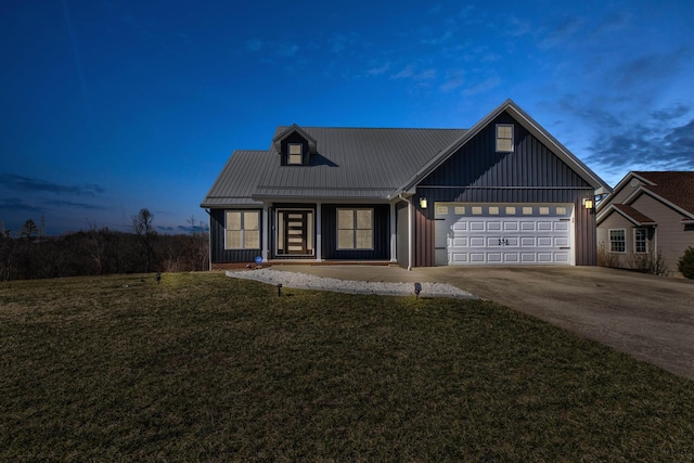 5141 Tristin Way, Catlettsburg, KY 41129 - view of front of property featuring board and batten siding, an attached garage, concrete driveway, and a front yard