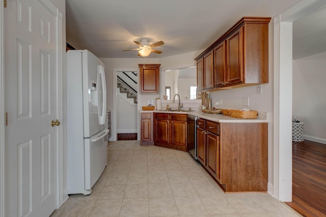 5141 Tristin Way, Catlettsburg, KY 41129 - kitchen featuring brown cabinetry, a ceiling fan, dishwasher, light countertops, and freestanding refrigerator
