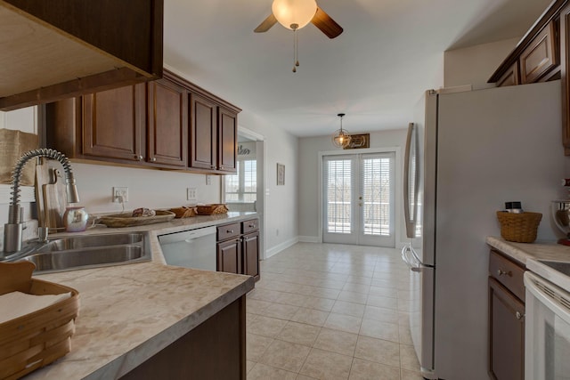 5141 Tristin Way, Catlettsburg, KY 41129 - kitchen featuring light tile patterned flooring, a sink, white appliances, light countertops, and french doors