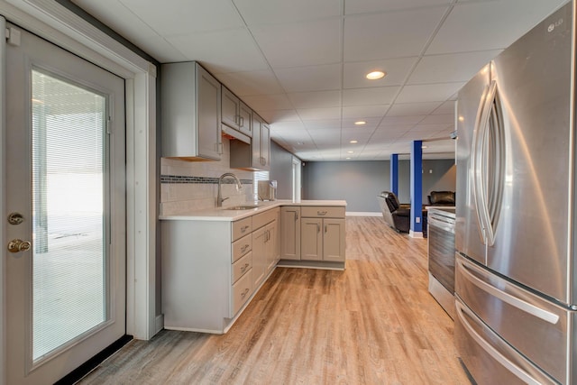 5141 Tristin Way, Catlettsburg, KY 41129 - kitchen featuring appliances with stainless steel finishes, a sink, light wood-style floors, light countertops, and a drop ceiling
