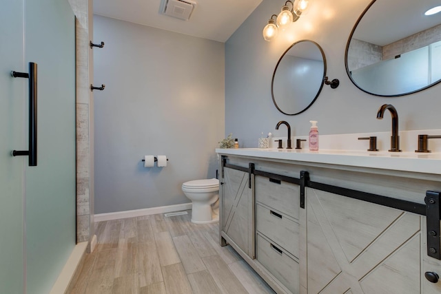 5141 Tristin Way, Catlettsburg, KY 41129 - bathroom with double vanity, visible vents, wood finished floors, a sink, and toilet