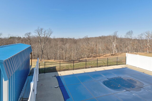 5141 Tristin Way, Catlettsburg, KY 41129 - view of patio / terrace featuring fence, a fenced in pool, and a forest view