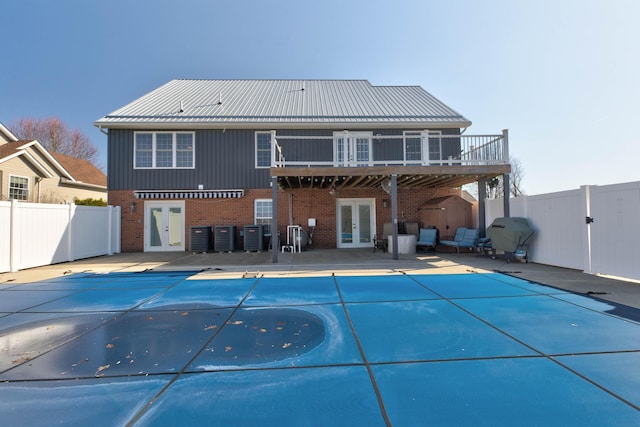 5141 Tristin Way, Catlettsburg, KY 41129 - rear view of property featuring brick siding, a fenced in pool, french doors, and a fenced backyard
