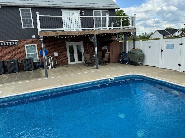 5141 Tristin Way, Catlettsburg, KY 41129 - back of house featuring french doors, a gate, a patio area, fence, and a fenced in pool