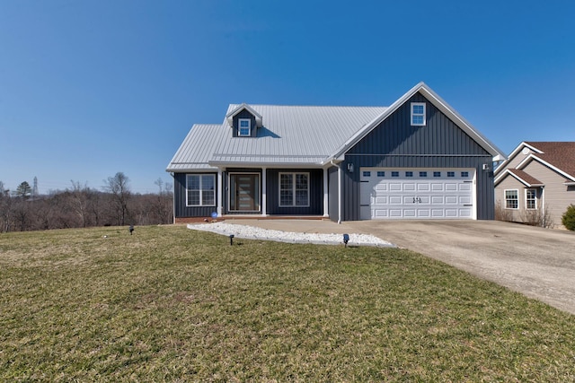 5141 Tristin Way, Catlettsburg, KY 41129 - view of front of house featuring an attached garage, a front lawn, and board and batten siding