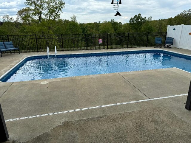 5141 Tristin Way, Catlettsburg, KY 41129 - view of swimming pool featuring a patio, fence, a forest view, and a fenced in pool