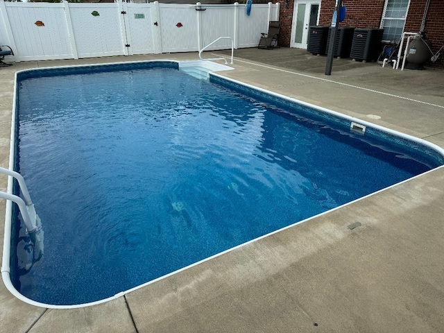 5141 Tristin Way, Catlettsburg, KY 41129 - view of swimming pool featuring a gate, a fenced in pool, fence, cooling unit, and a patio