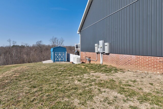5141 Tristin Way, Catlettsburg, KY 41129 - view of home's exterior featuring a storage unit, an outdoor structure, and a yard