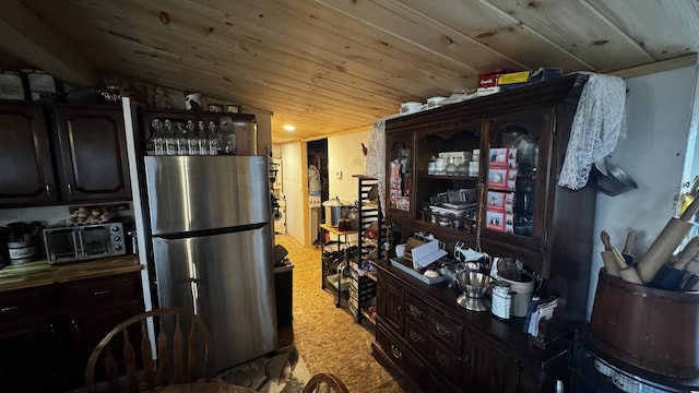 kitchen with a toaster and freestanding refrigerator