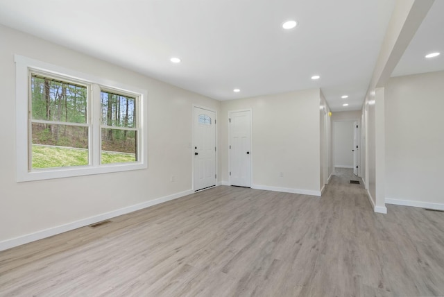 730 E Spencer Rd, Campton, KY 41301 - unfurnished living room with baseboards, recessed lighting, visible vents, and light wood-type flooring
