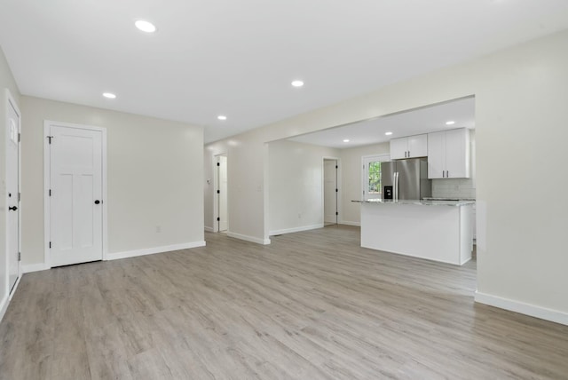 730 E Spencer Rd, Campton, KY 41301 - unfurnished living room featuring recessed lighting, light wood-type flooring, and baseboards