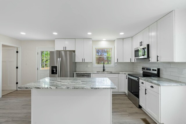 730 E Spencer Rd, Campton, KY 41301 - kitchen with stainless steel appliances, a center island, a sink, and plenty of natural light