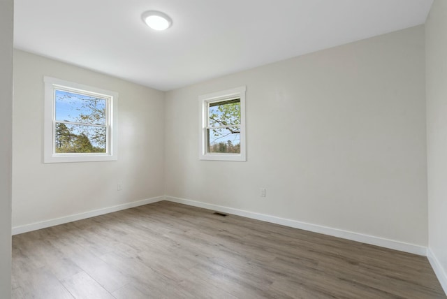 730 E Spencer Rd, Campton, KY 41301 - unfurnished room featuring baseboards, wood finished floors, and visible vents