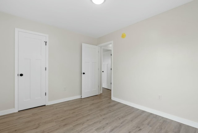 730 E Spencer Rd, Campton, KY 41301 - unfurnished bedroom with light wood-style flooring and baseboards
