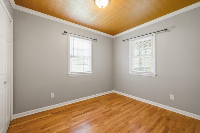 6473 Wildie Rd, Mount Vernon, KY 40456 - spare room featuring baseboards, a healthy amount of sunlight, and light wood finished floors