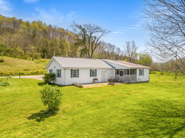 6473 Wildie Rd, Mount Vernon, KY 40456 - back of property featuring a yard and metal roof