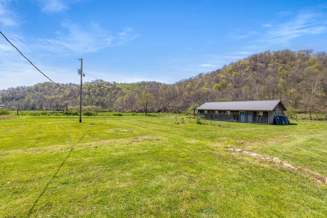 6473 Wildie Rd, Mount Vernon, KY 40456 - view of yard featuring a rural view, an outbuilding, and a view of trees