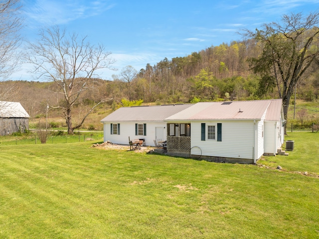 6473 Wildie Rd, Mount Vernon, KY 40456 - back of house featuring a yard, central AC, and metal roof