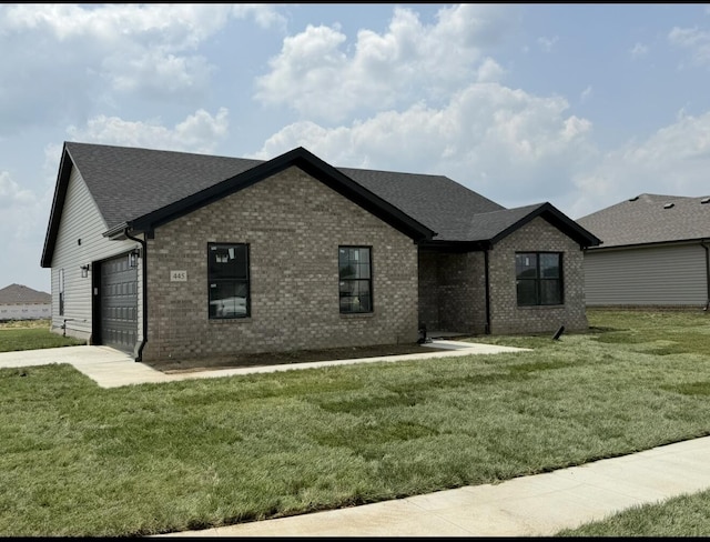 445 Wyldwood Way, Berea, KY 40403 - view of front of home featuring brick siding, an attached garage, a front yard, a shingled roof, and driveway