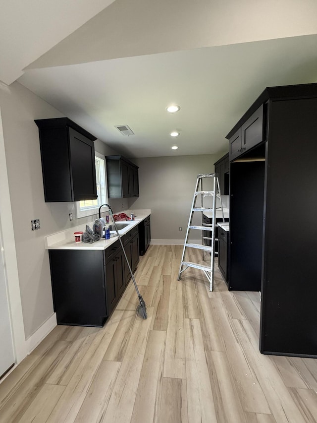 445 Wyldwood Way, Berea, KY 40403 - kitchen featuring dark cabinetry, light wood-type flooring, light countertops, and recessed lighting