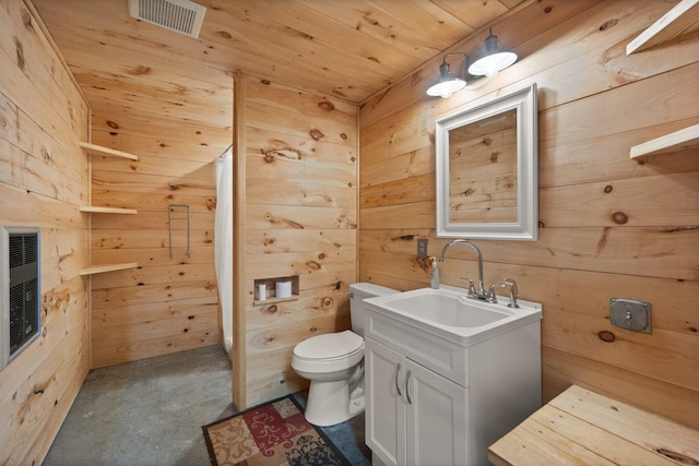 full bath with toilet, wood walls, visible vents, and vanity