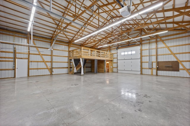 garage with a garage door opener and metal wall
