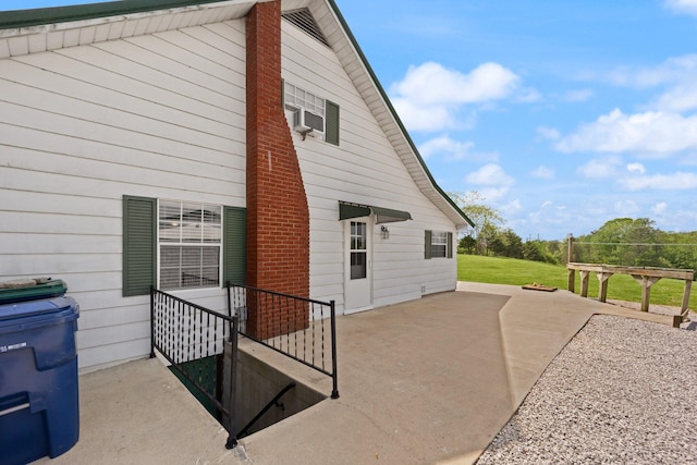 exterior space with a chimney and a patio area