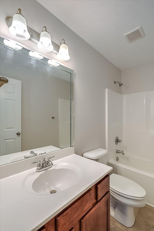 bathroom featuring tile patterned floors,  shower combination, toilet, visible vents, and vanity
