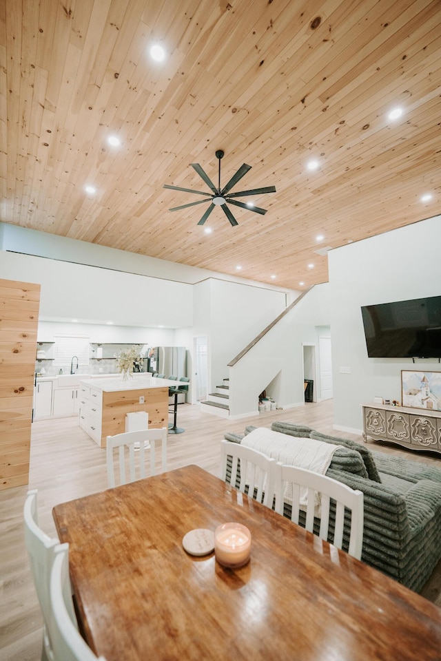 dining room with wooden ceiling, recessed lighting, and stairs