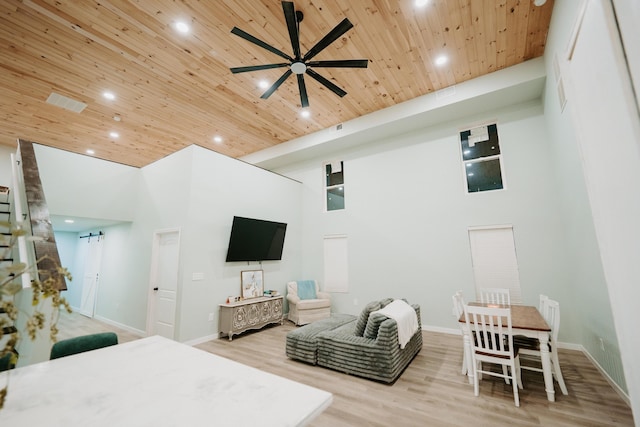 bedroom with wood ceiling, baseboards, a high ceiling, and recessed lighting