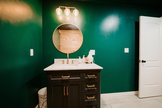 bathroom featuring tile patterned flooring, baseboards, and vanity