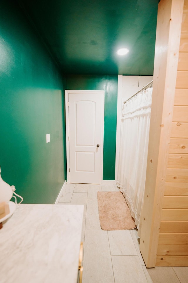 bathroom with recessed lighting and tile patterned flooring
