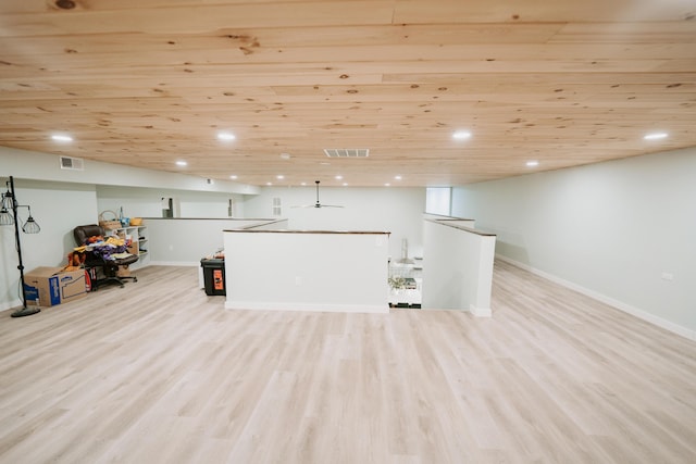 below grade area with baseboards, visible vents, recessed lighting, and light wood-style floors