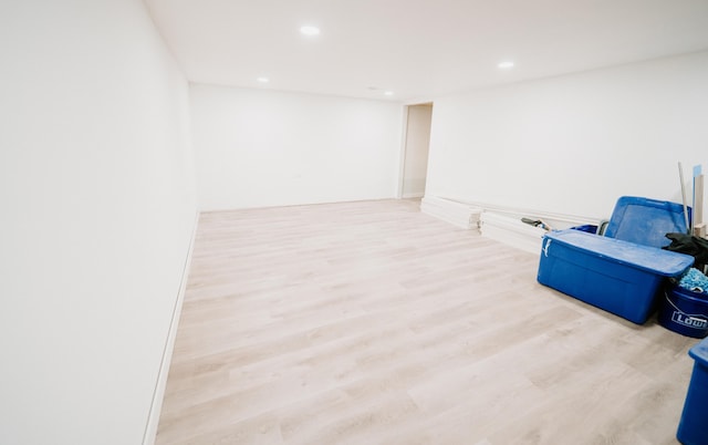 basement with wood finished floors and recessed lighting